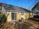 Back of house with sliding glass door and small patio at 3710 Burntwood Ct, Charlotte, NC 28227