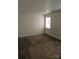 Simple bedroom with brown carpeting and a window at 3710 Burntwood Ct, Charlotte, NC 28227