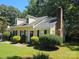 View of the home's exterior, showcasing a yellow vinyl-sided house at 3710 Burntwood Ct, Charlotte, NC 28227