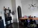 An interior view of a dining room with a bar and doorway leading to the entryway at 3905 Autumn Wood Dr # 28, Monroe, NC 28112