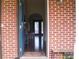 Welcoming entryway with an open blue door showcasing the interior's hardwood floors and decor at 3905 Autumn Wood Dr # 28, Monroe, NC 28112