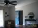 View of living room with hardwood floors, corner couch, and blue front door in background at 3905 Autumn Wood Dr # 28, Monroe, NC 28112