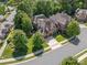 Aerial view of a charming house and its surrounding landscape at 5942 Carmel Rd, Charlotte, NC 28226