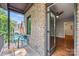 Private balcony with brick wall and partial view of backyard at 5942 Carmel Rd, Charlotte, NC 28226