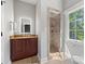 Bathroom with a vanity, a walk-in shower, and a window at 5942 Carmel Rd, Charlotte, NC 28226