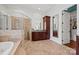 Elegant bathroom with soaking tub, walk-in shower, and vanity at 5942 Carmel Rd, Charlotte, NC 28226