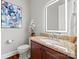 Modern powder room with granite countertop and lighted mirror at 5942 Carmel Rd, Charlotte, NC 28226