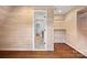 Spacious walk-in closet with built-in shelving and wood walls at 5942 Carmel Rd, Charlotte, NC 28226