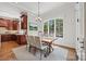 Bright breakfast area with hardwood floors and a window seat at 5942 Carmel Rd, Charlotte, NC 28226