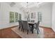 Elegant dining room with chandelier and hardwood floors at 5942 Carmel Rd, Charlotte, NC 28226