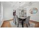 Elegant dining room features hardwood floors, a chandelier, and wainscoting at 5942 Carmel Rd, Charlotte, NC 28226