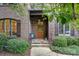 Inviting front entrance with stone accents and wooden door at 5942 Carmel Rd, Charlotte, NC 28226