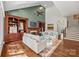 Spacious Gathering room with a fireplace, built-in shelving, and hardwood floors at 5942 Carmel Rd, Charlotte, NC 28226