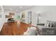 Bright upper hallway with hardwood floors and seating area at 5942 Carmel Rd, Charlotte, NC 28226