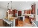 Gourmet kitchen boasts granite countertops and custom cabinetry at 5942 Carmel Rd, Charlotte, NC 28226