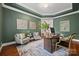 Bright home office with hardwood floors and built-in shelving at 5942 Carmel Rd, Charlotte, NC 28226