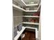 Well-organized pantry with ample shelving and a built-in bench at 5942 Carmel Rd, Charlotte, NC 28226