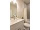 Modern bathroom with white vanity, updated fixtures and a bathtub at 621 Seldon Dr, Charlotte, NC 28216