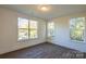 Bright bedroom with hardwood floors and large windows at 621 Seldon Dr, Charlotte, NC 28216