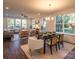 Bright dining room with modern table and chairs, hardwood floors at 621 Seldon Dr, Charlotte, NC 28216