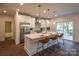 Modern kitchen with white cabinets, stainless steel appliances, and island at 621 Seldon Dr, Charlotte, NC 28216