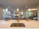 Modern kitchen island with sink and seating overlooking living room at 621 Seldon Dr, Charlotte, NC 28216