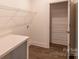 Laundry room with built-in shelving and countertop at 621 Seldon Dr, Charlotte, NC 28216