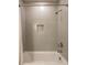 Clean bathroom with a shower/tub combo and updated tile at 621 Seldon Dr, Charlotte, NC 28216