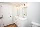 Updated bathroom with double vanity, marble countertops, and elegant light fixtures at 164 Lentz Rd, Stony Point, NC 28678