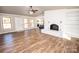 Living room with hardwood floors, fireplace, and built-in shelving at 164 Lentz Rd, Stony Point, NC 28678