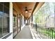 Covered porch with ceiling fan and wooded views at 2360 Smith Harbour Dr, Denver, NC 28037