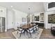 Open concept view of dining room with hardwood floors, views of the kitchen and plenty of natural light at 5055 Elm View Dr # 25, Charlotte, NC 28277