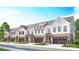 New construction townhome featuring a two-car garage, light brick accents, and modern architectural details at 5055 Elm View Dr # 25, Charlotte, NC 28277