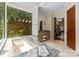 Bright bathroom featuring a soaking tub beneath a large window with natural views at 10310 Wildlife Rd, Charlotte, NC 28278