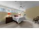 Bedroom featuring a bed, natural light from multiple windows, and carpeted floor at 10310 Wildlife Rd, Charlotte, NC 28278