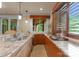Butler's pantry with granite countertops, wooden cabinets, and a sink for seamless serving and storage at 10310 Wildlife Rd, Charlotte, NC 28278