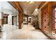 Expansive foyer featuring marble floors and a staircase; great architectural detail at 10310 Wildlife Rd, Charlotte, NC 28278