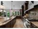 Gourmet kitchen featuring granite countertops, stainless steel appliances, and custom cabinetry at 10310 Wildlife Rd, Charlotte, NC 28278