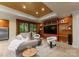 Basement living room with comfortable seating, built-in shelving, and natural light from a window at 10310 Wildlife Rd, Charlotte, NC 28278