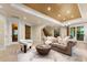 Basement living room features a comfortable seating area, a bar area, and access to the outside at 10310 Wildlife Rd, Charlotte, NC 28278