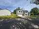 Two story home featuring manicured lawn, attached garage and covered entry at 1313 Dodd St, Shelby, NC 28152