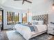 Main bedroom with tufted headboard and lake views at 8566 Birchwood Ln, Terrell, NC 28682