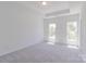 Bright bedroom with neutral walls and carpet, recessed lighting, and large window at 222 Gilead Rd, Huntersville, NC 28078