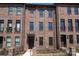 Beautiful brick townhome featuring detailed trim, a small balcony, and a well-manicured lawn at 222 Gilead Rd, Huntersville, NC 28078