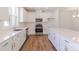 Well-lit kitchen boasts white cabinets, stainless steel appliances, and a spacious island at 222 Gilead Rd, Huntersville, NC 28078