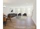 Virtually staged living room featuring a comfortable sofa and ample natural light at 222 Gilead Rd, Huntersville, NC 28078
