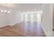 Bright, open-concept living room with large windows and hardwood floors at 222 Gilead Rd, Huntersville, NC 28078
