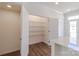Bright pantry featuring shelving with a modern white door near the kitchen at 222 Gilead Rd, Huntersville, NC 28078