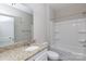 Bright bathroom boasts granite countertops, white cabinets, and a shower/tub combo at 2707 Crescent Ln, Gastonia, NC 28052