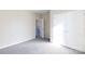 Bedroom with grey carpet and access to hallway at 2707 Crescent Ln, Gastonia, NC 28052